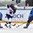 ZUG, SWITZERLAND - APRIL 26: USA's Auston Matthews #19 stick handles the puck while Finland's Juuso Valimaki #6 and Kasper Bjorkqvist #11defend during gold medal game action at the 2015 IIHF Ice Hockey U18 World Championship. (Photo by Matt Zambonin/HHOF-IIHF Images)

